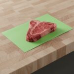 Green Steak Paper 10" x 30" shown with steak on sheet