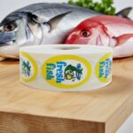 Fresh Fish oval label with a fish image and the text fresh fish on the sticker