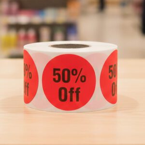 50 percent off sticker on a round red label with black text