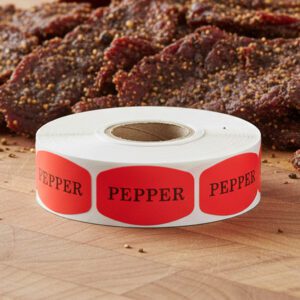 pepper stickers on a roll of red labels with black print