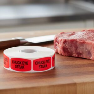 chuck eye steak stickers on a roll of red labels with black print