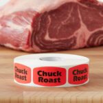 chuck roast stickers on a roll of red labels with black print