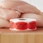 boneless chicken breast stickers on a roll of red labels with black print