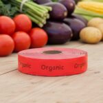 organic red sticker on a roll of labels