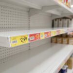 Clear Adhesive Molding Strips 48 inches in use in empty retail shelving