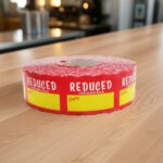 Reduced for quick sale sticker with room to write price and message on red label with yellow print