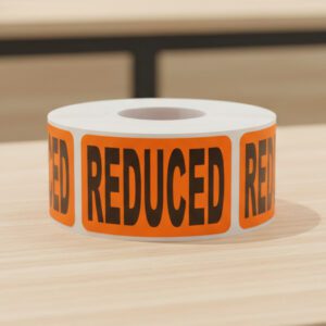 reduced sticker on an orange rectangle label with black print