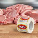 Pork Ribbon Sticker on a white label with red and yellow print