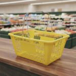 Yellow Plastic Shopping Baskets with sign and stand in a 12 PACK of baskets
