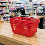 Red Plastic Shopping Baskets with sign and stand in a 12 PACK of baskets