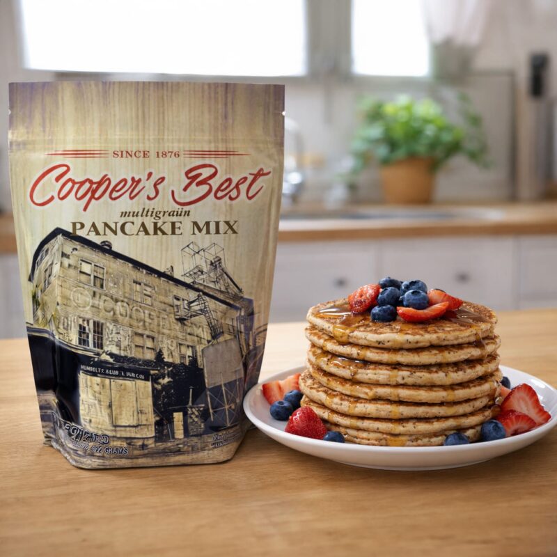 90299 Cooper’s Best Multigrain Pancake Mix next to freshly made Multigrain Pancakes Square Cooper's Best Multigrain Pancake Mix next to freshly made Multigrain Pancakes