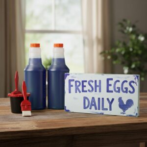 blue sign making ink in 2 16oz bottles and a 1 inch foam brush for painting signs