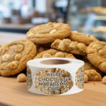 White chocolate macadamia nut labels on a roll of 500 stickers for bakery use