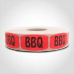 bbq label with red background on roll of stickers