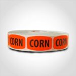 corn label with red background on roll of stickers