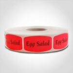 egg salad label with red background on roll of stickers
