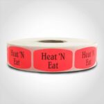 heat n eat label with red background on roll of stickers