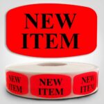 New Item Label Dayglo Sticker on a roll of 1000 labels, reads NEW ITEM in black on read label