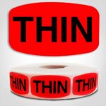 Thin Label Red Dayglo Sticker on a roll of 1000 labels, reads Thin in black print on red label