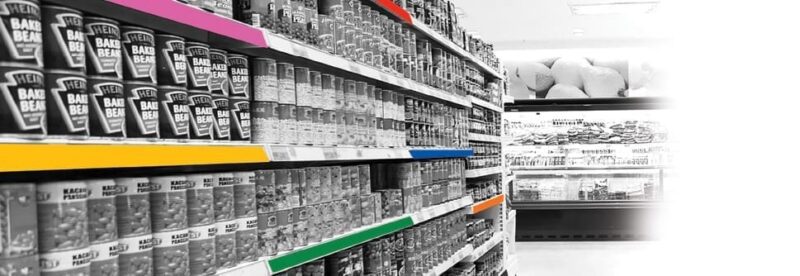 Colored molding strips in use on retail shelving