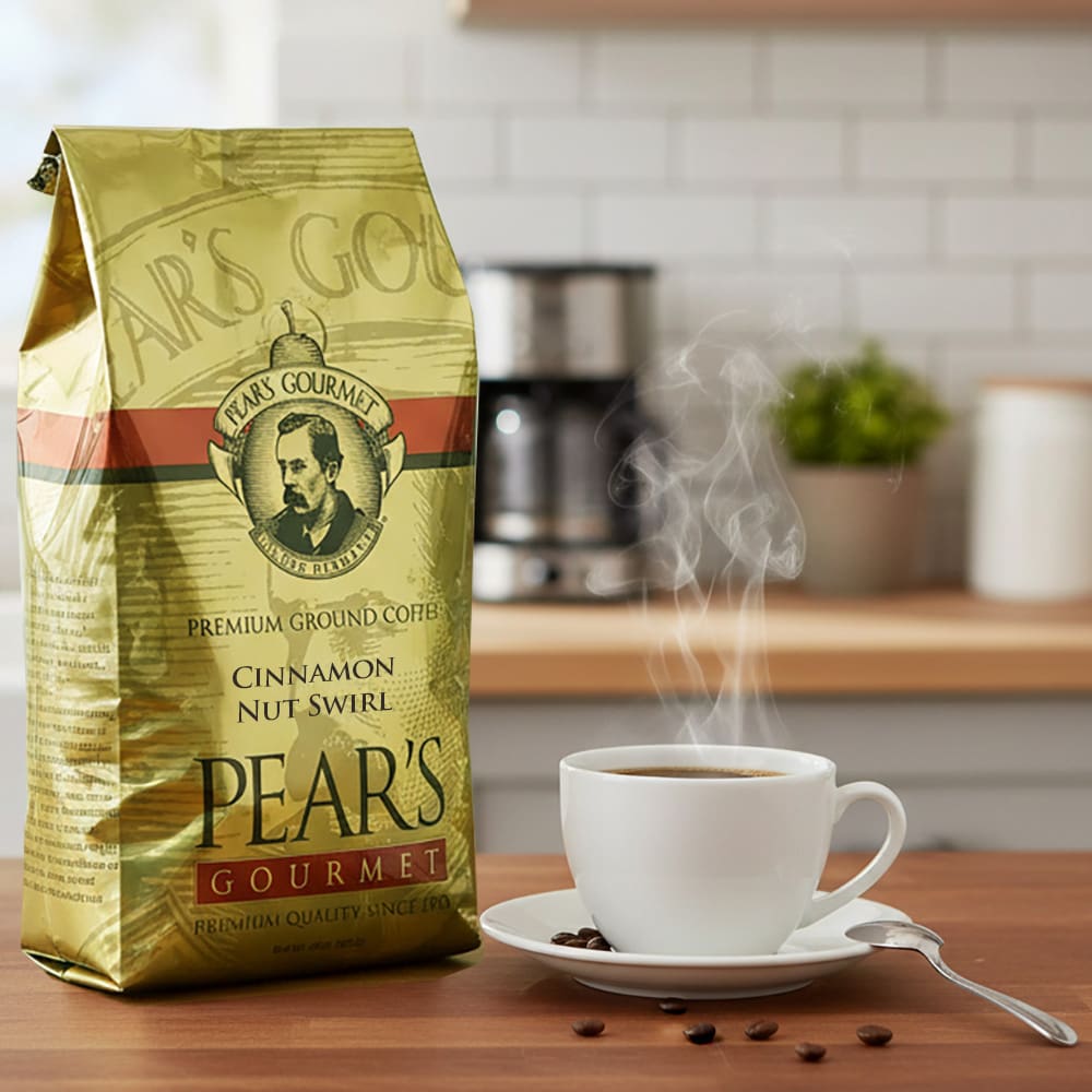 34662 Pear’s Coffee Cinnamon Nut Swirl 24oz next to a cup of coffee Pear's Coffee Cinnamon Nut Swirl 24oz next to a cup of coffee