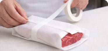 Freezer tape being used on butcher paper