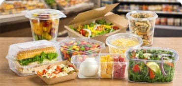 Disposable Takeout meal containers sitting on deli counter in supermarket