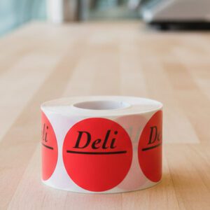 Deli circle sticker with room to write on a red label with black print
