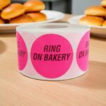 ring on bakery label round pink circle with ring on bakery text in black
