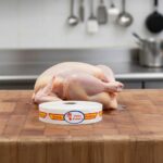 fresh poultry bilingual spanish and english strap label on butcher block
