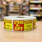 In Store 2 dollar off coupon sticker on a rectangle label with red and yellow print