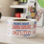3 dollars off bonus savings coupon sticker on a roll of rectangle white labels with red and blue print