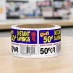 50 cents off instant savings coupon sticker on a roll of rectangle white labels with red, yellow and blue print