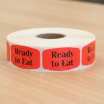 ready to eat sticker on a red label with black text