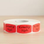 country style sticker on a red label with black print