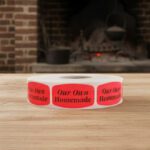 homemade sticker on a red label with black text