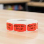 special price sticker on a red label with black text