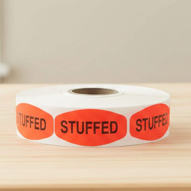 stuffed sticker on a red label with black text
