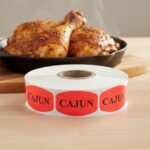 cajun sticker on a red label with black print