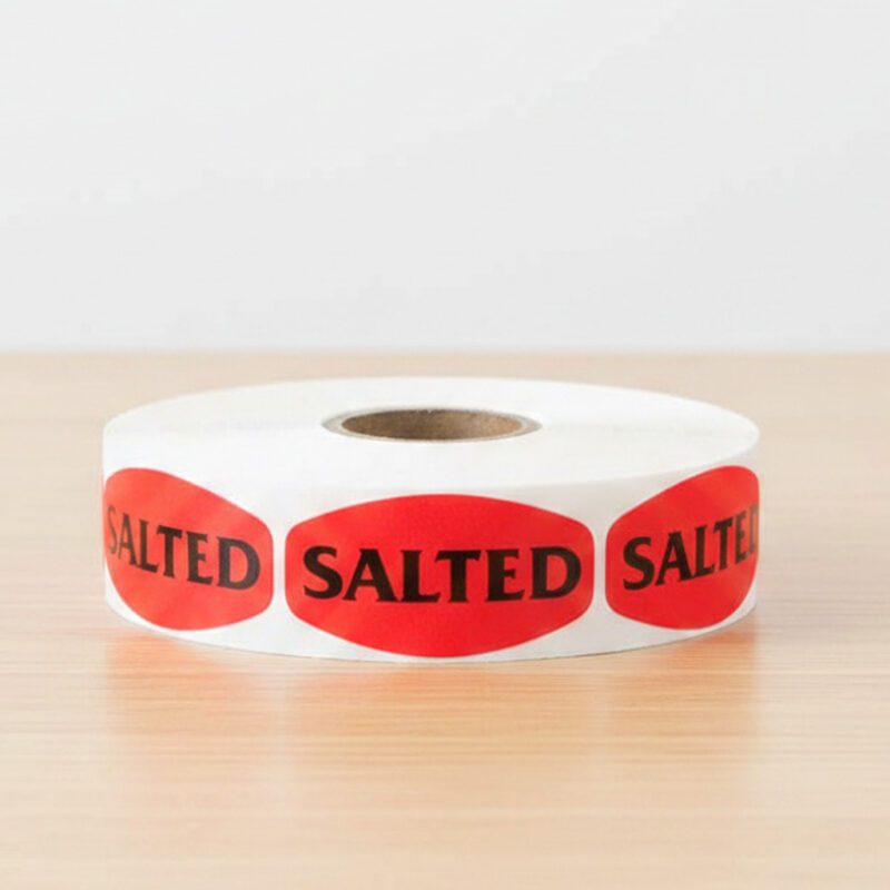salted sticker on a red label with black text