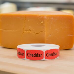 cheddar sticker on a red label with black print