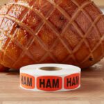 ham sticker on a red label with black print