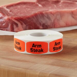 arm steak sticker on a red label with black print
