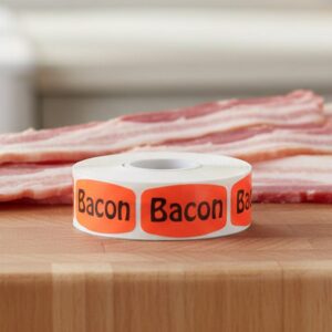 bacon sticker on a red label with black print