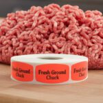 fresh ground chuck sticker on a red label with black print