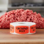 ground beef sticker on a red label with black print