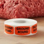 ground round sticker on a red label with black print