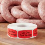 our own pork sausage sticker on a red label with black text