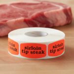 sirloin tip steak sticker on a red label with black text