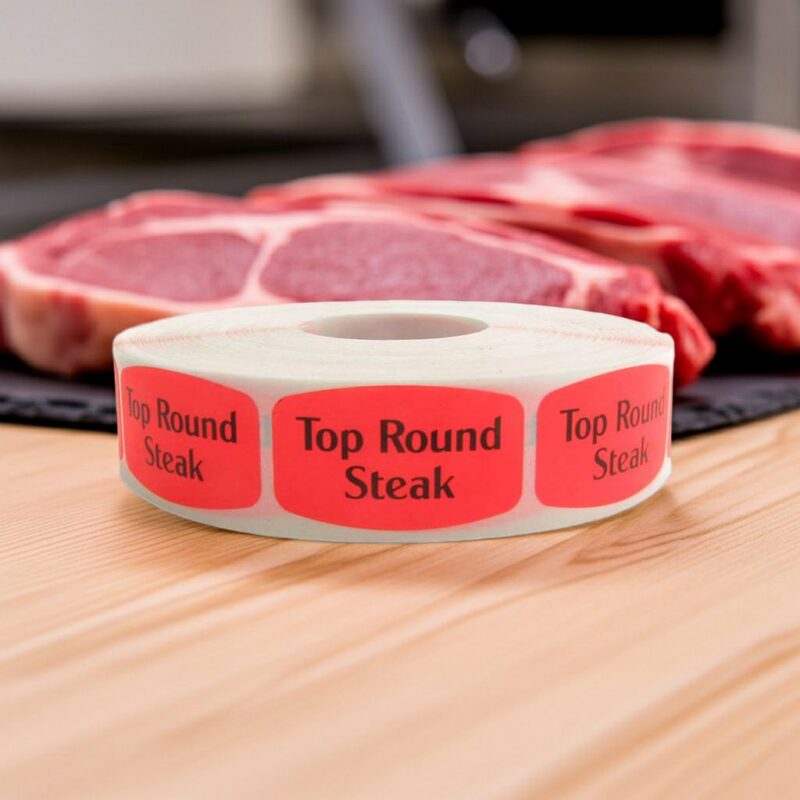 Top Round Steak Butcher sticker red identification label with black print on a roll of stickers
